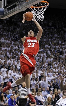 New Mexico guard Phillip McDonald (23) scores during the second half of an NCAA college basketball game against BYU in Provo, Utah, Wednesday, March...