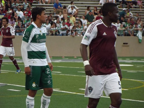 Oswaldo Alanis of Laguna Santos and Danny Mwanga of Colorado look on.