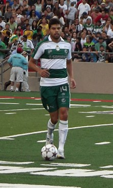 Nestor Aurujo of Laguna Santos dribbles towards the far sideline.