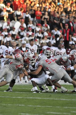 Lobo defense takes down an Aggie
 Carmen Messina (58), Dallas Bollema (41), Anthony Hooks (6)