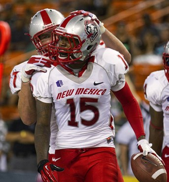 New Mexico tight end Lucas Reed (97) congratulates wide receiver SaQwan Edwards (15) after Edwards scored a touchdown against Hawaii in the first...