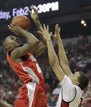 New Mexico's A.J. Hardeman shoots over UNLV's Derrick Jasper.