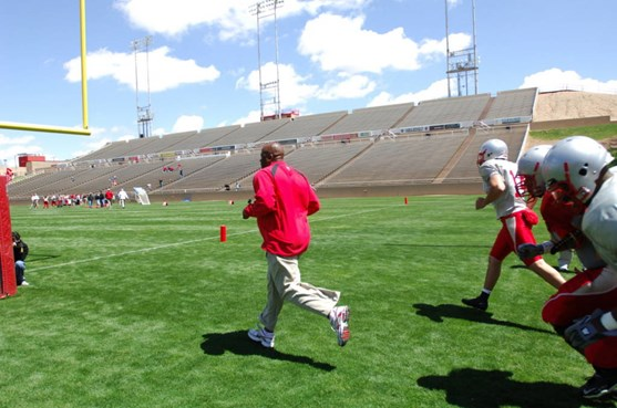 Mike Locksley leads his team onto the field!