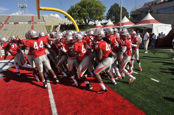 The Lobos run out onto the field together at the beginning of the first half.