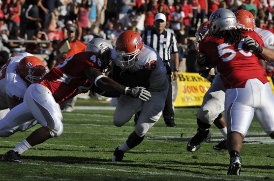 Defensive linemen Rod Davis and Jaymar Latchison stop Sam Houston's Keyshawn Hill