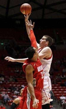 New Mexico forward Drew Gordon defends the shot of Utah center David Foster.