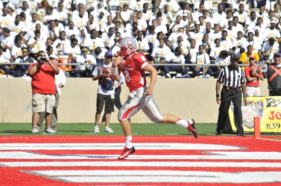Freshman quarterback Cole Gautsche storms in the endzone for a touchdown vs. Southern University. Gautsche had one of the Lobos' three rushing TDs....