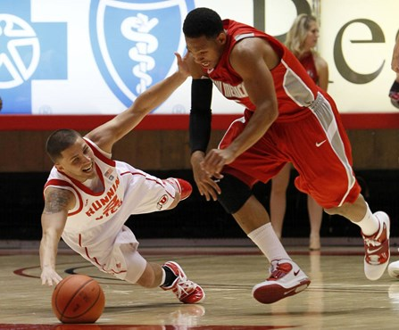 Utah guard Chris Kupets falls to the court after having the ball stolen away by New Mexico guard Dairese Gary.