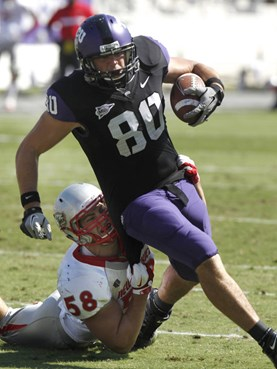 TCU tight end Logan Brock (80) runs after a reception as New Mexico linebacker Carmen Messina (58) tries to pull him down during the first half of an...