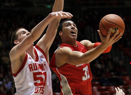 New Mexico forward Drew Gordon attempts to score against Utah center David Foster.