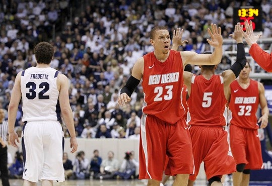 New Mexico guard Phillip McDonald (23) celebrates as BYU guard Jimmer Fredette (32) walks away during the second half of an NCAA college basketball...