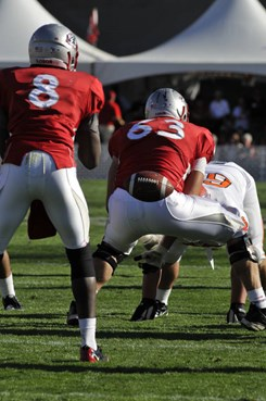 Dillon Farrel snaps the ball to quarterback Tarean Austin