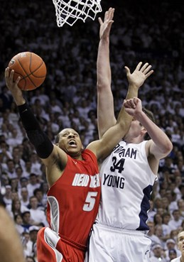 New Mexico guard Dairese Gary (5) attempts to score past BYU forward Noah Hartsock (34) during the second half of an NCAA college basketball game in...