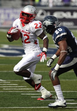 Nevada defender Duke Williams (20) pursues New Mexico running back Crusoe Gongbay (22) during the second quarter. (AP Photo/Cathleen Allison)
