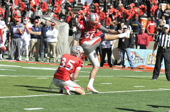 Justus Adams kicks the extra point