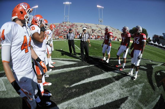 Lobo game captains Carmen Messina, Freddy Young and LaMar Bratton meet with Sam Houston's captains prior to kickoff