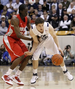 BYU guard Jimmer Fredette, right, is pressured by New Mexico guard Tony Snell during the second half of an NCAA college basketball game in Provo,...