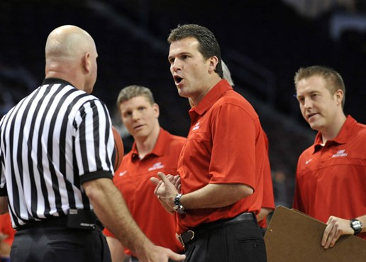 New Mexico head coach Steve Alford has a few words with a referee.