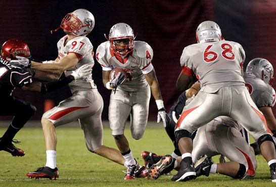 New Mexico running back Demarcus Rogers (4) runs against San Diego State in the second half. San Diego State beat New Mexico 35-7.  (AP Photo/Gregory...