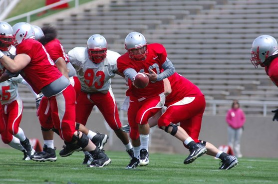 QB Brad Gruner goes for this handoff Saturday.
