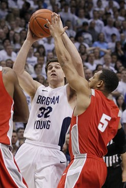 BYU guard Jimmer Fredette (32) is pressured by New Mexico guard Dairese Gary (5) during the first half of an NCAA college basketball game in Provo,...